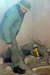 Stefan gets a fire started to warm the chilly evening.