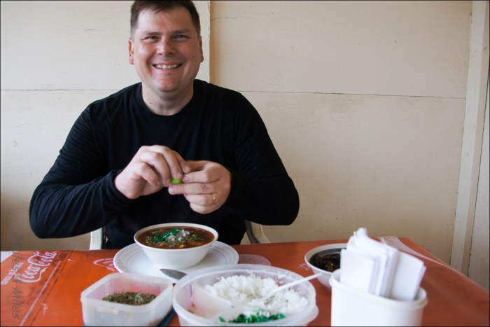 Miles enjoying a bowl of menudo.