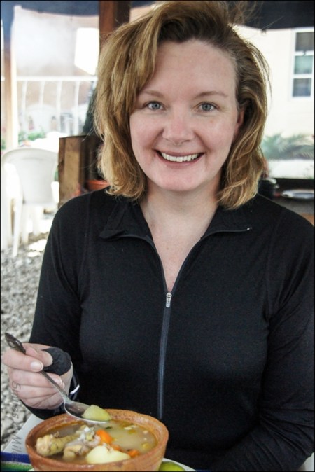 Tracey enjoying a bowl of good old-fashioned chicken soup - Guatemalan style.