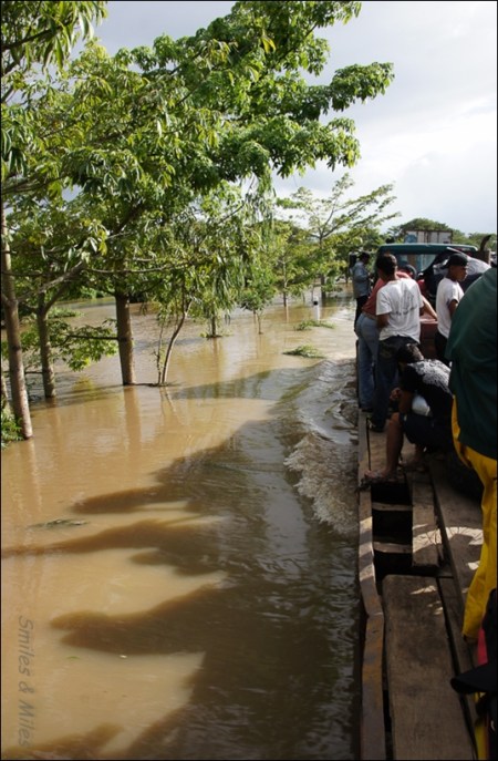 We make our way aboard a flat-bed trailer.